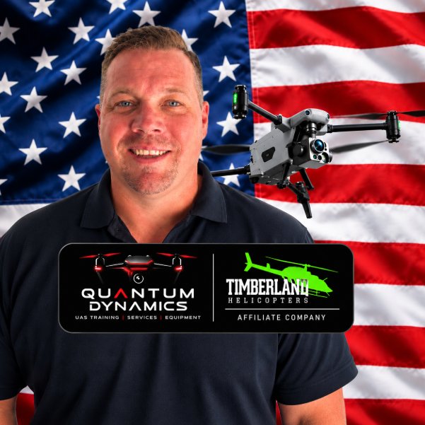 Portrait of Sean McKay Holt in front of an American flag, with a drone and the Quantum Dynamics and Timberland Helicopters logos